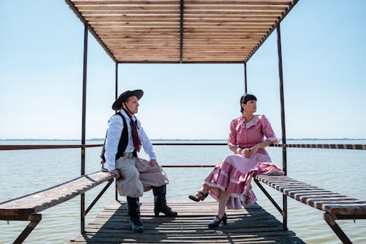 Gauchos in traditional attire relax by Chascomús Lake in Argentina.